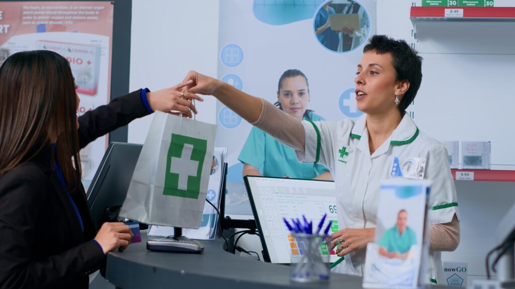Woman in chemist store at checkout